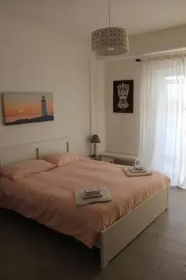 a bedroom with a bed with two towels on it at La Casa di Andly in Palermo