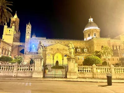 a large building with a fence in front of it at La Siciliana-di fronte la Cattedrale in Palermo