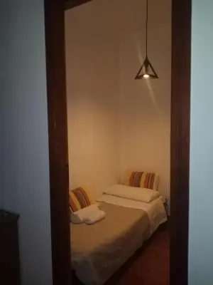 a mirror reflection of a bedroom with two beds at Casa Rosamarina in Mondello
