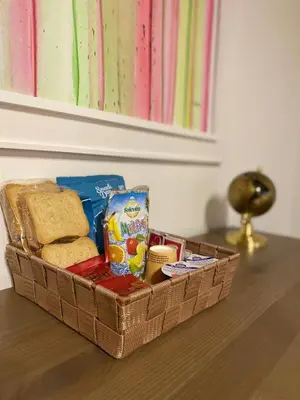 a basket of bread and cheese on a table at Le stanze di Ruggero in Palermo
