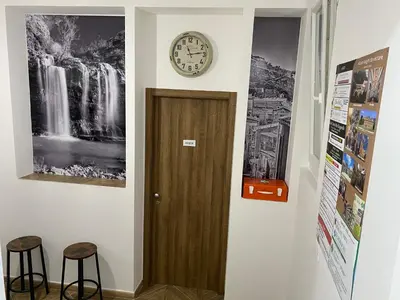 a clock on a wall next to a door at DREAM CORLEONE ONE in Corleone