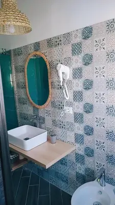 a bathroom with a sink and a mirror at DIMENTICA IL CERVELLO in Palermo