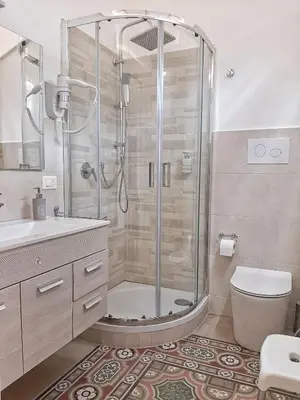 a bathroom with a shower and a toilet at Ai Quartieri in Palermo