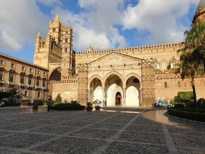 a large building with a clock tower on top of it at Stanze Di Leo in Palermo