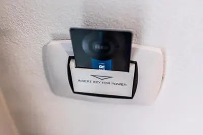 a lightswitch on a wall with a sign on it at La Casa di Lilù in Palermo
