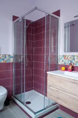 a bathroom with a shower with a sink and a toilet at B&B Rainbow in Campofelice di Roccella