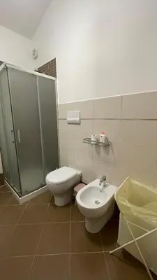 a bathroom with a shower and a toilet and a sink at Casa vacanza 