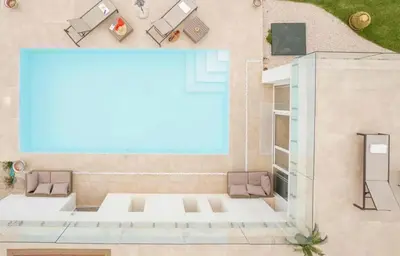 an overhead view of a living room with a large window at Curina Luxury Villa - Panoramic Pool Villa near Scopello in Castellammare del Golfo