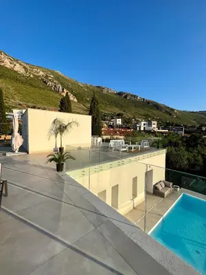 a view from the roof of a house with a swimming pool at Curina Luxury Villa - Panoramic Pool Villa near Scopello in Castellammare del Golfo