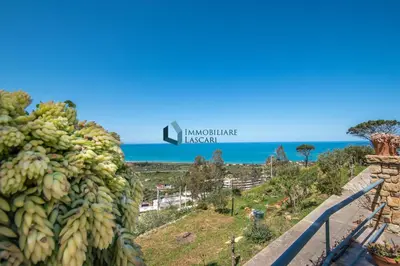 a bunch of bananas on a hill next to the ocean at Villa Panorama in Cefalù