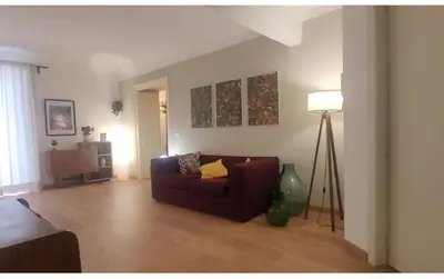 a living room with a couch and a lamp at Appartamento in centro Titi's place in Palermo