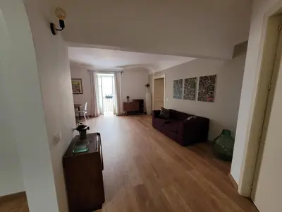 a living room with a couch and a table at Appartamento in centro Titi's place in Palermo