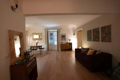 a living room with a couch and a table at Appartamento in centro Titi's place in Palermo
