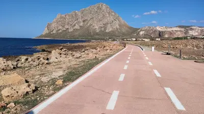 an empty road with a mountain in the background at Stella del Mare San Vito Lo Capo in San Vito lo Capo