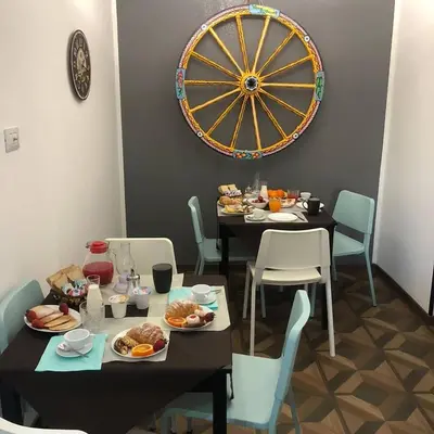 a dining room with a table with plates of food at nonno peppe in Palermo