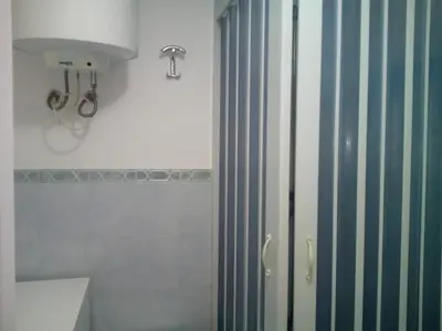 a shower in a bathroom with a shower curtain at La Casetta di Dafne in Palermo