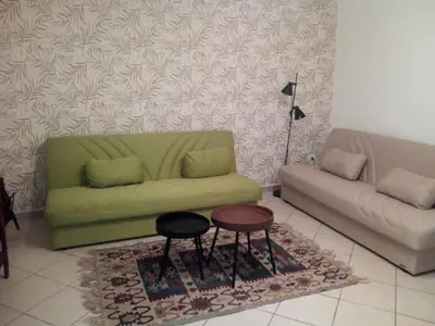a living room with a couch and a table at La Casetta di Dafne in Palermo
