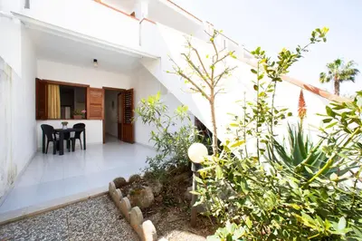 an external view of a house with a garden at APPARTAMENTI BLUSANVITO P-TERRA in San Vito lo Capo