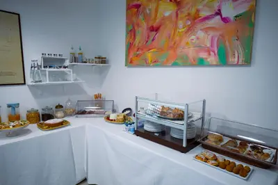 a table with various pastries and food on it at AWA Mondello in Mondello