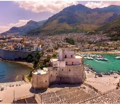 an aerial view of a town with boats in the water at Casa vacanza Corallo in Castellammare del Golfo
