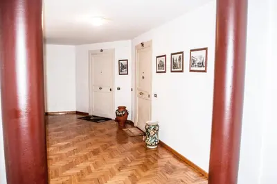 a hallway with a cat standing in the middle of a room at Da Ale alla Cattedrale in Palermo