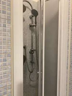 a shower with two shower heads in a bathroom at Casa di fronte la Cattedrale in Palermo