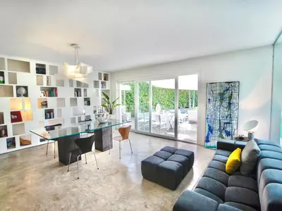a living room with a blue couch and a table at Villa Re di Denari by Interhome in Terrasini
