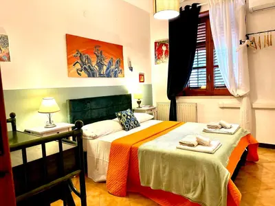 a bedroom with two beds with towels on them at Villa dell’Orsa in Cinisi
