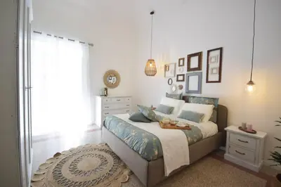 a bedroom with a bed with a table on it at La Casetta 90139 in Palermo