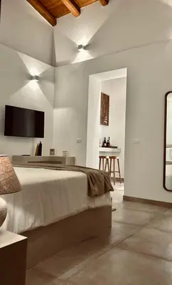 an office with a desk with a computer and a laptop at Palermo Inn Boutique Hotel in Palermo