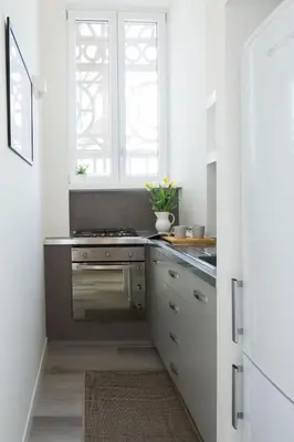 a kitchen with a stove and a window at Loft Trinacria con Vista Mare by Wonderful Italy in Palermo