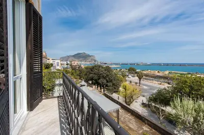 a balcony with a view of the ocean at Loft Trinacria con Vista Mare by Wonderful Italy in Palermo