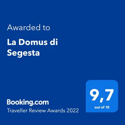 a blue text box with the words awarded to la domus de siesta at La Domus di Segesta in Calatafimi