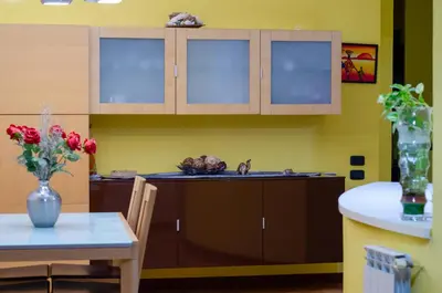 a kitchen with a sink and a table at POLICLINICO HOME in Palermo
