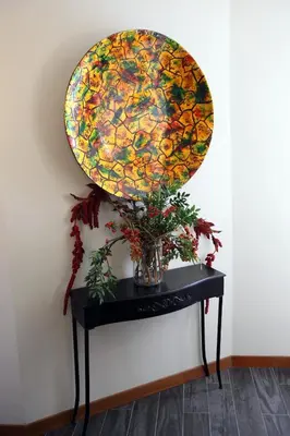 a large colorful plate on top of a table at Accardi House Searooms in Palermo