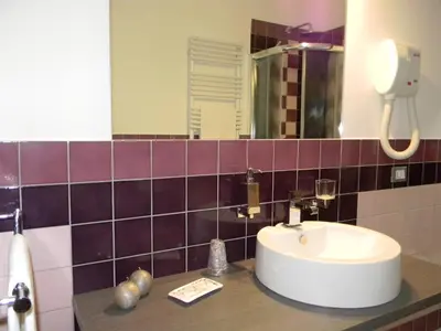 a bathroom with a sink and a mirror at B&B Oreto Centro in Palermo