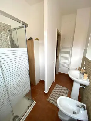 a bathroom with a sink and a toilet and a shower at Casa dello Spasimo in Palermo