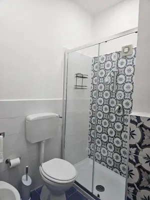 a bathroom with a toilet and a shower at la palma in Castellammare del Golfo