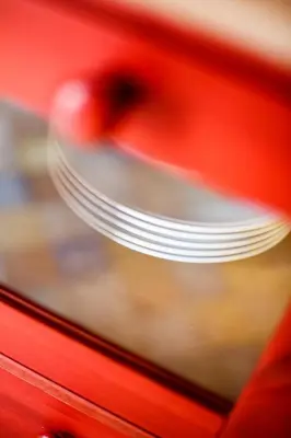 a stack of plates sitting on top of a red object at SanvitoTour - Oasi nel Mare in San Vito lo Capo