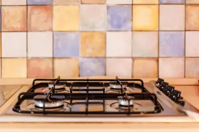 a stove top oven sitting in a kitchen at SanvitoTour - Oasi nel Mare in San Vito lo Capo