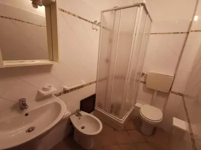 a bathroom with a shower and a toilet and a sink at Frida casavacanze in Castellammare del Golfo