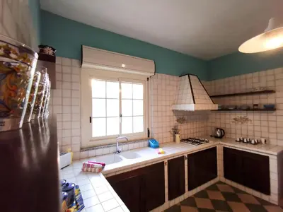 a kitchen with a sink and a window at Frida casavacanze in Castellammare del Golfo