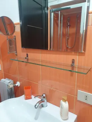 a bathroom with a sink and a mirror at A Casa Tua in Palermo