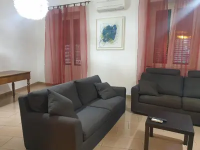 a living room with a couch and a table at A Casa Tua in Palermo