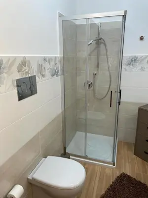 a bathroom with a shower and a toilet at Appartamento Sunrise in San Vito lo Capo