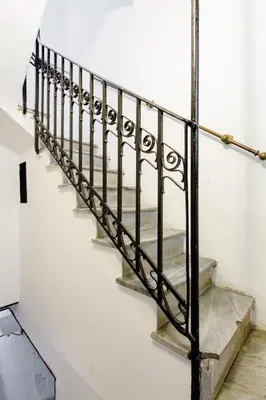 a set of stairs with a metal railing at Sweet home Ballaro' in Palermo