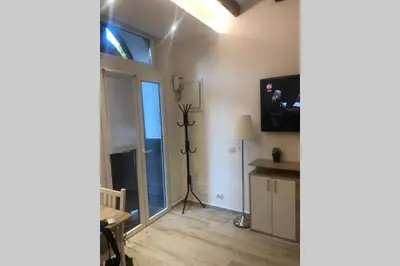 a living room with a window and a tv at casa vacanza roberto in Palermo