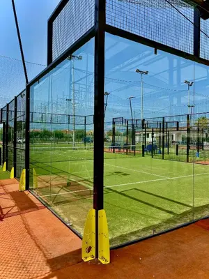 a tennis court with a net on a tennis court at Campofelice Holidays in Campofelice di Roccella