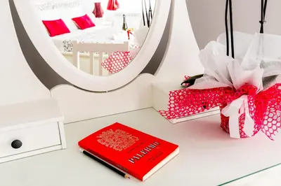 a desk with a red book and a mirror at Dream Home in Palermo