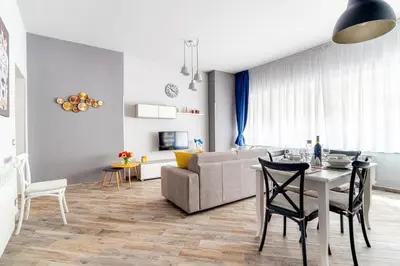 a living room with a table and a couch at Dream Home in Palermo
